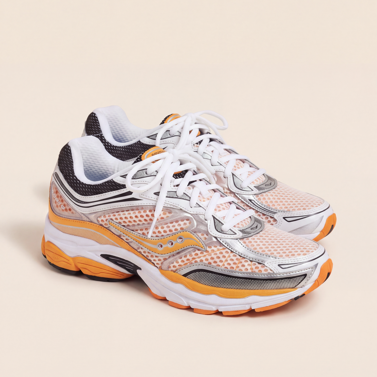 Saucony ProGrid Omni 9 in White / Orange / Silver